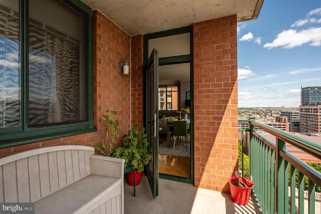 a view of balcony with furniture