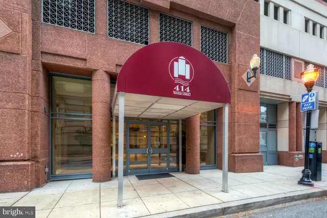 a view of a brick building with a potted plant