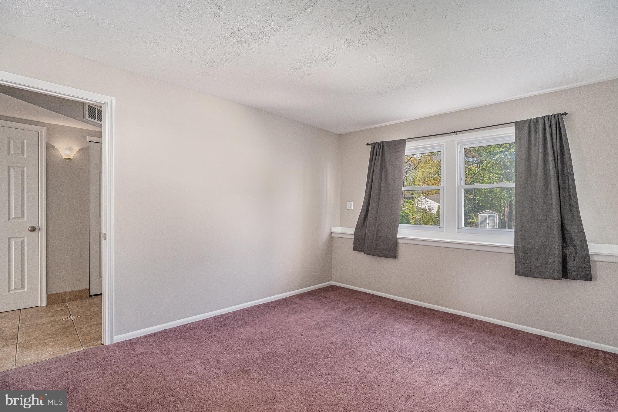 621 Kismet Road Philadelphia, PA 19115 - Photo 8 of 38 an empty room with windows