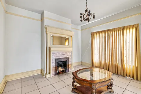 a view of a livingroom with furniture and a fireplace