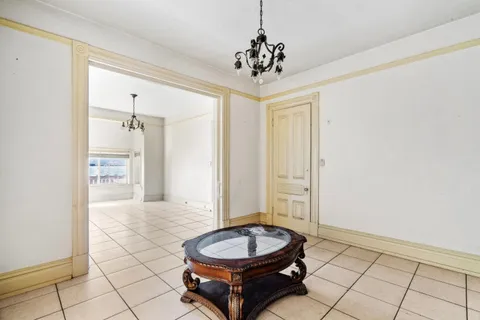 a bathroom with a granite countertop sink a toilet and shower
