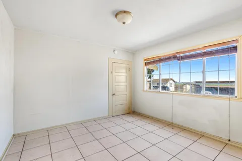 a view of a kitchen and window