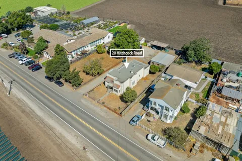 an aerial view of residential house with parking space