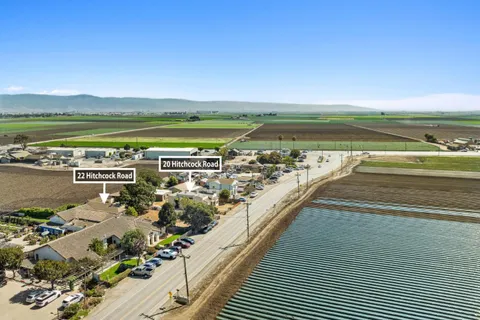 a view of swimming pool with outdoor seating and ocean view