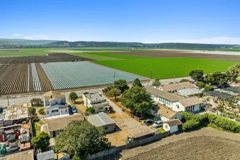 an aerial view of a house with a lake view