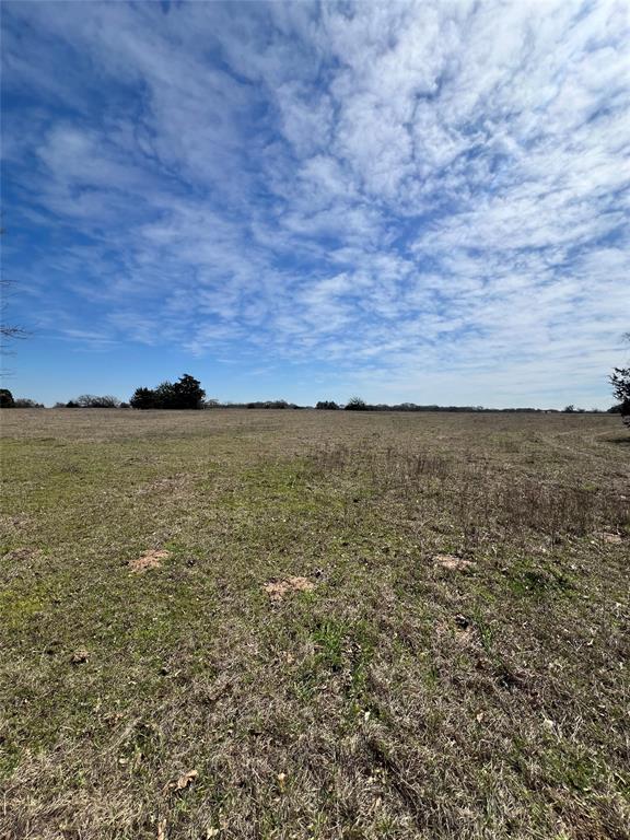 View of yard with a rural view