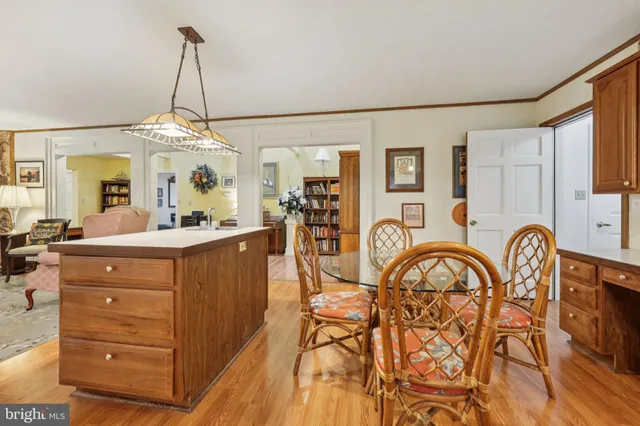 a kitchen with granite countertop a sink and a refrigerator