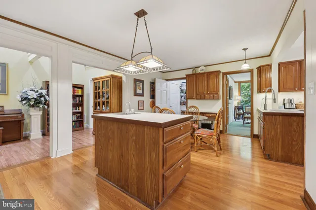 a kitchen with a cabinets and wooden floor