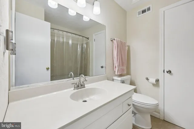 a bathroom with a toilet and a sink