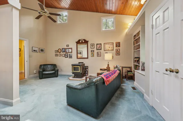 a backyard of a house with barbeque oven table and chairs