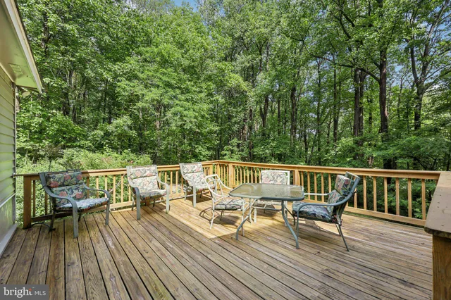 a view of a house with a backyard and garden