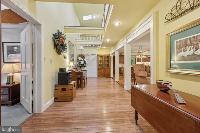 a living room with furniture and a lamp