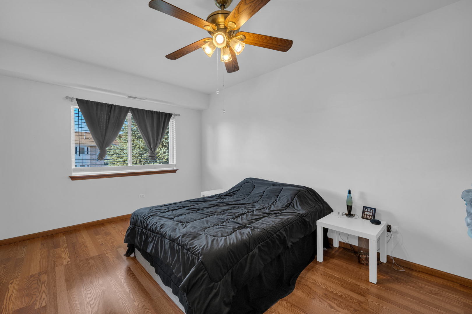 717 North 5th Avenue, Unit 302 Addison, IL 60101 - Photo 11 of 25 a bedroom with a bed and a window