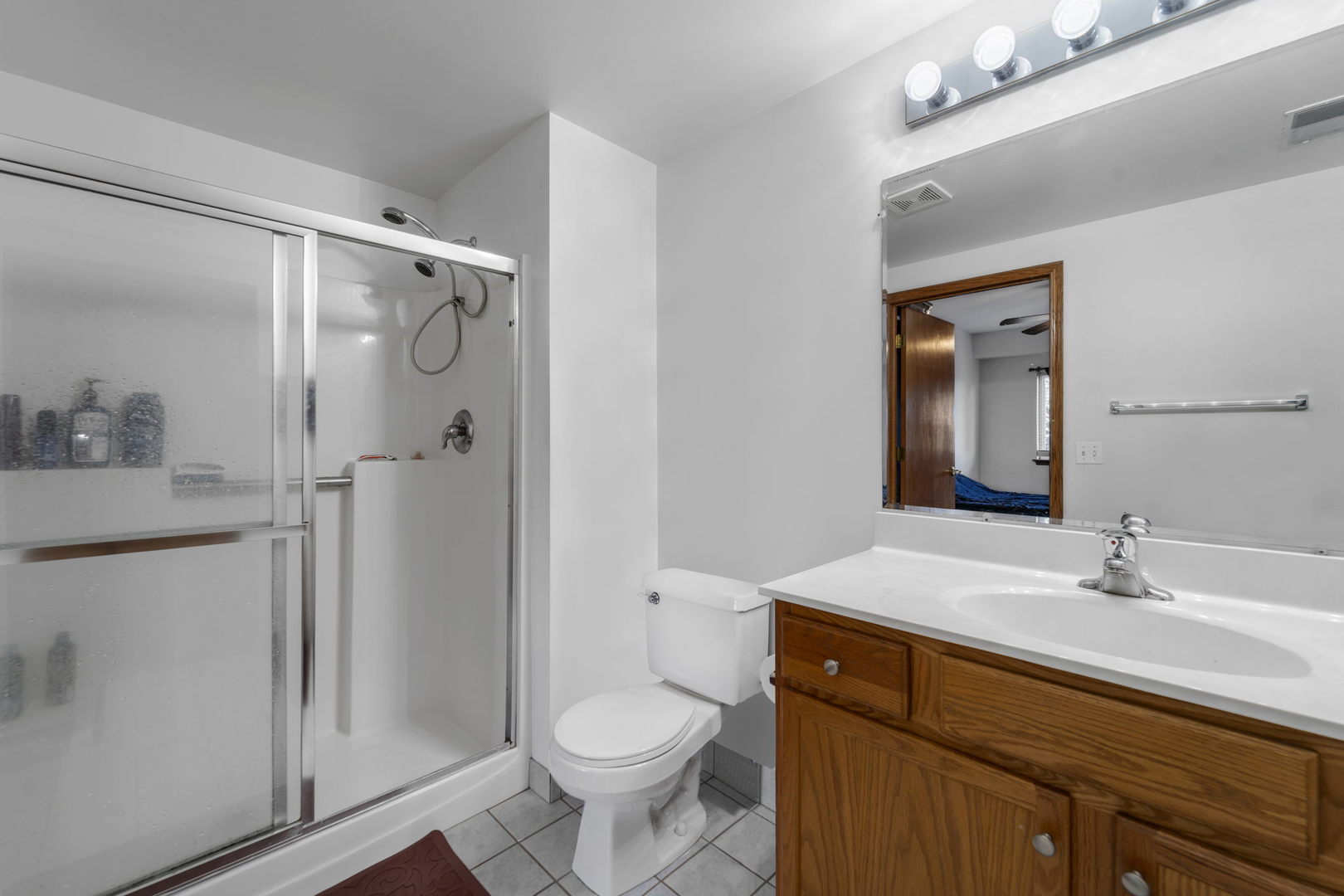 717 North 5th Avenue, Unit 302 Addison, IL 60101 - Photo 12 of 25 a bathroom with a sink a toilet and shower