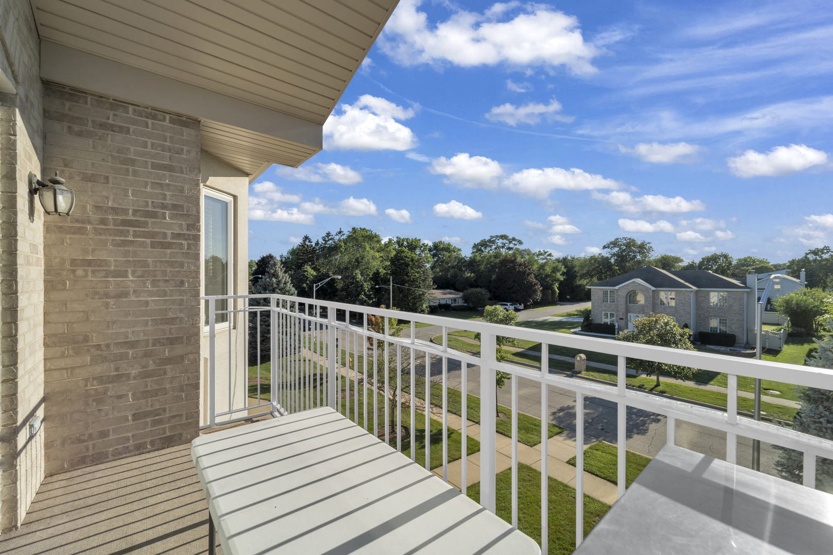 717 North 5th Avenue, Unit 302 Addison, IL 60101 - Photo 13 of 25 a view of a balcony with wooden floor and fence