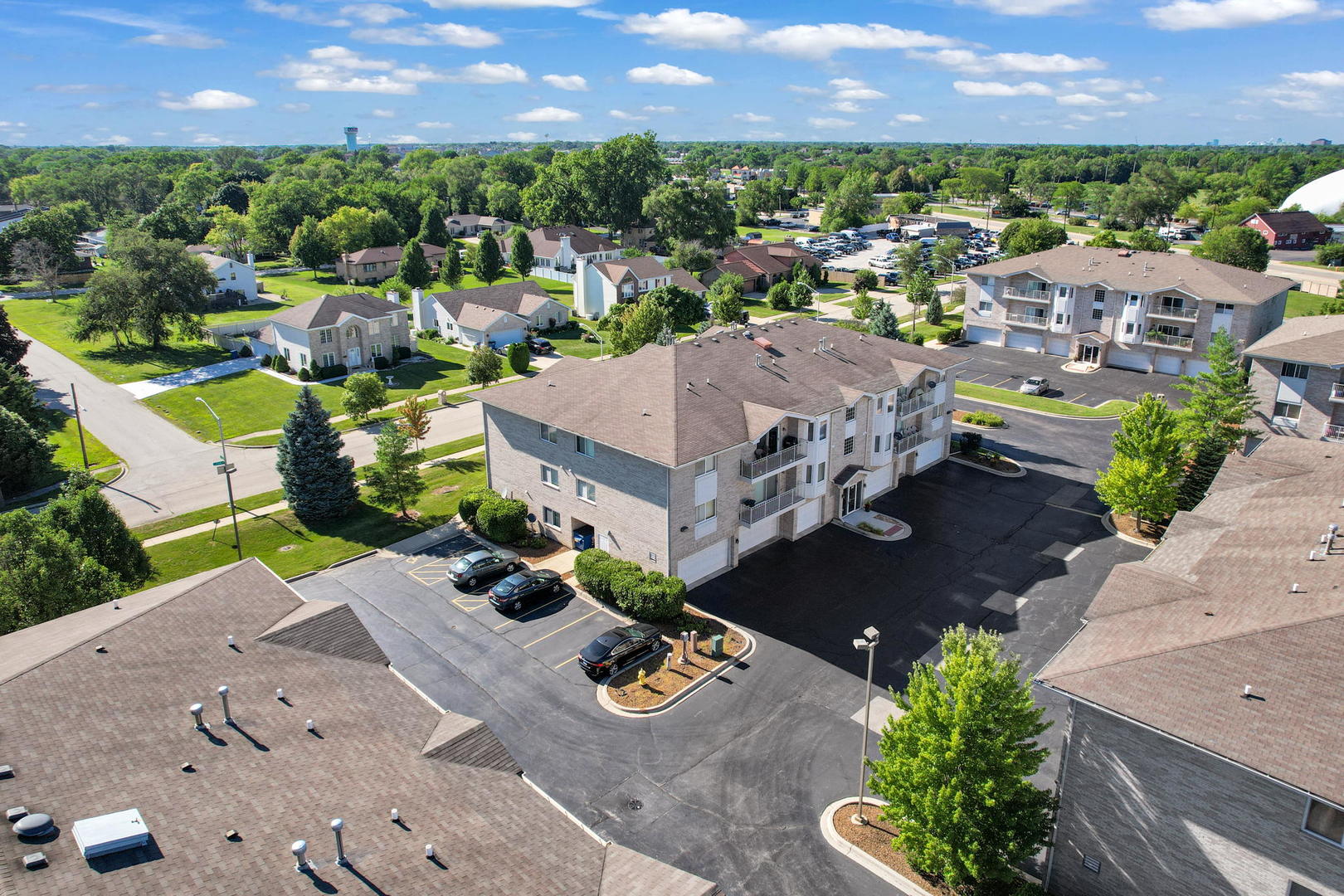 717 North 5th Avenue, Unit 302 Addison, IL 60101 - Photo 22 of 25 an aerial view of a house with a garden
