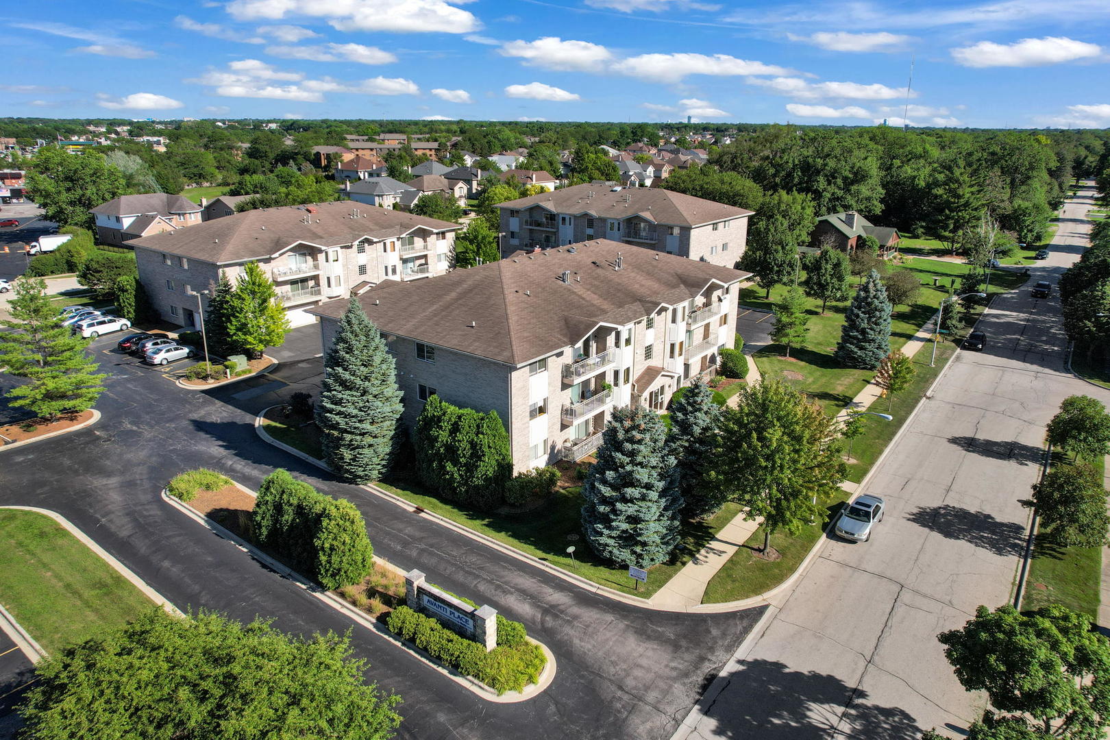 717 North 5th Avenue, Unit 302 Addison, IL 60101 - Photo 24 of 25 an aerial view of a house with a garden