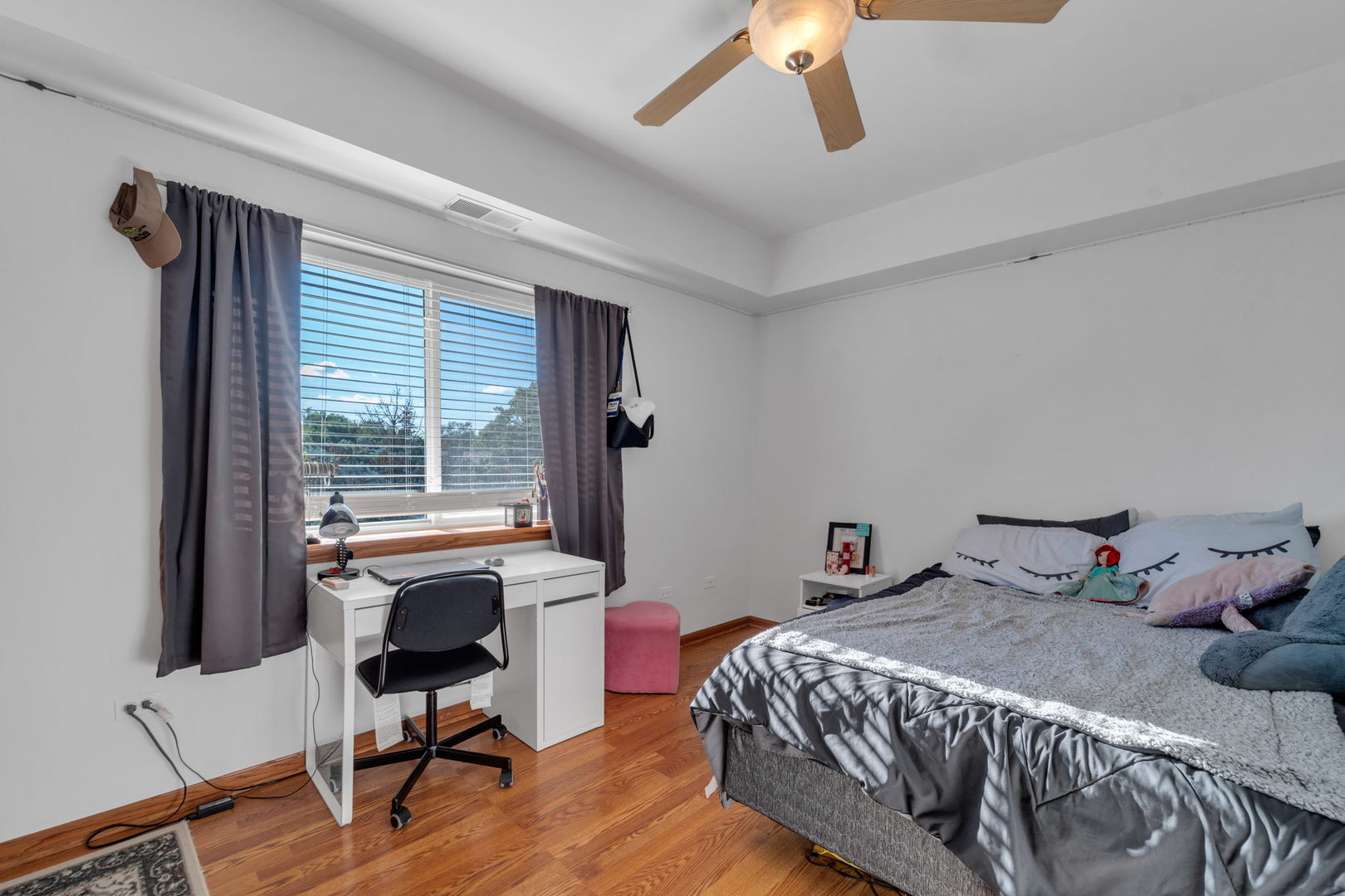 717 North 5th Avenue, Unit 302 Addison, IL 60101 - Photo 9 of 25 a bedroom with a bed and wooden floor