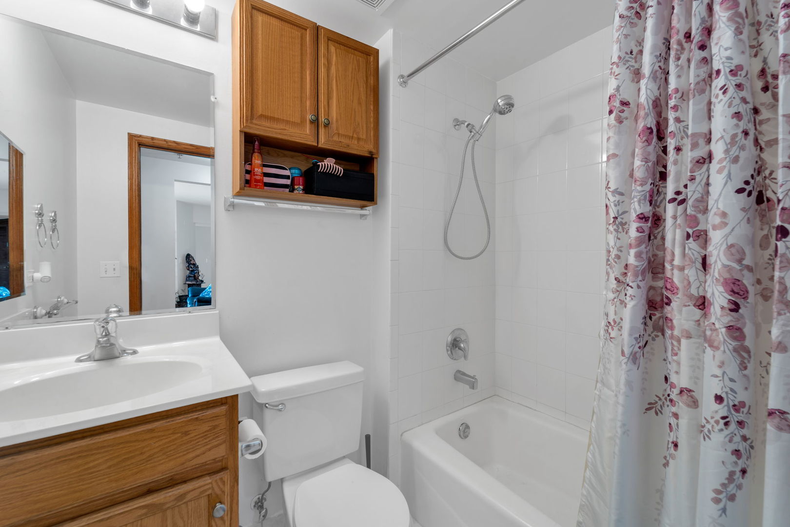 717 North 5th Avenue, Unit 302 Addison, IL 60101 - Photo 10 of 25 a bathroom with a sink a toilet and shower