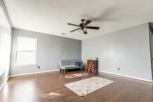 a living room with furniture and a window