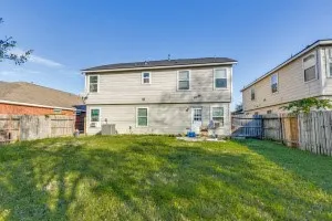 a view of a house with a yard and sitting area