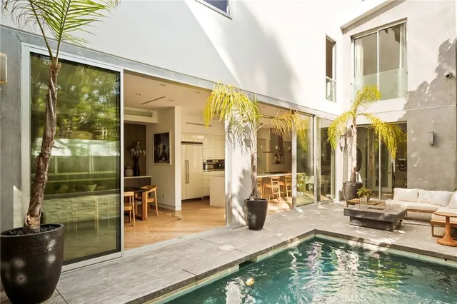 a view of a dining room with furniture wooden floor and chandelier