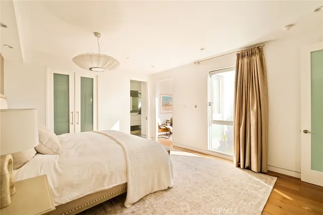 a bathroom with a double vanity sink a mirror and a bathtub