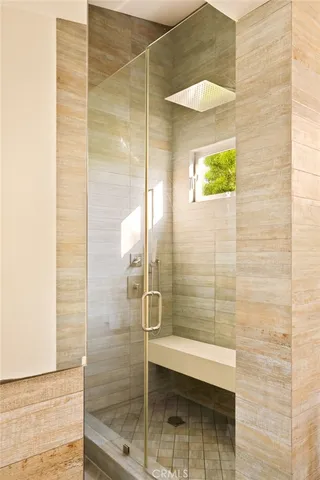 a bathroom with a sink toilet and large mirror