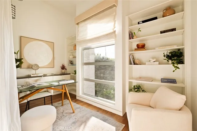 a backyard of a house with barbeque oven table and chairs