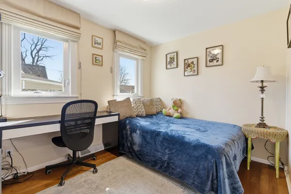 a bedroom with a workspace