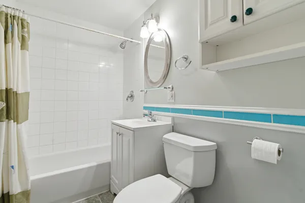a bathroom with a sink a toilet and bathtub