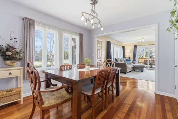 a view of a dining room with furniture window and wooden floor