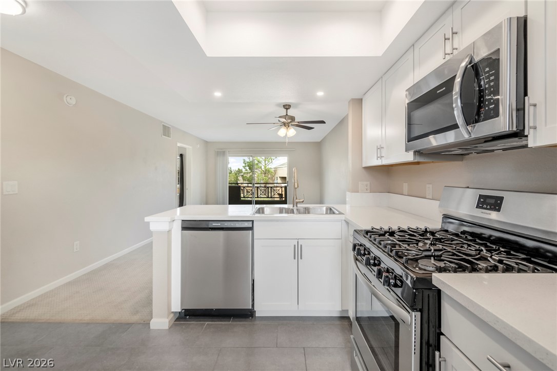 8070 West Russell Road, Unit 2006 Las Vegas, NV 89113 - Photo 4 of 24 A well-appointed kitchen features a gas range and sleek stainless steel appliances.