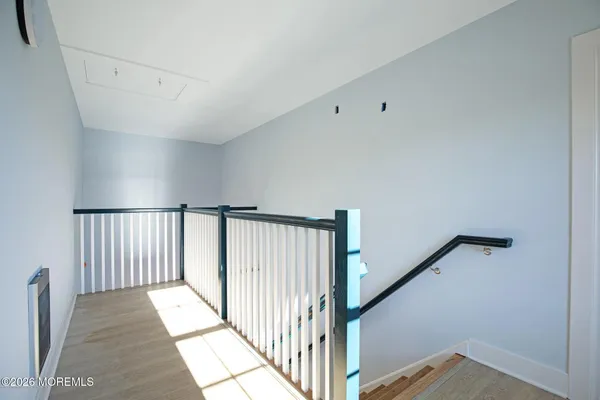 a view of a hallway with staircase