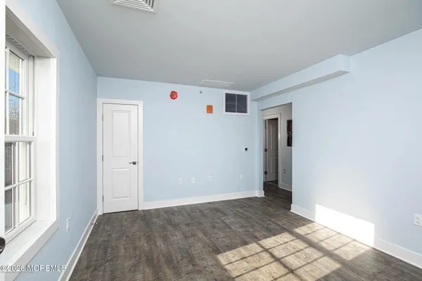 a view of livingroom with hallway and closet
