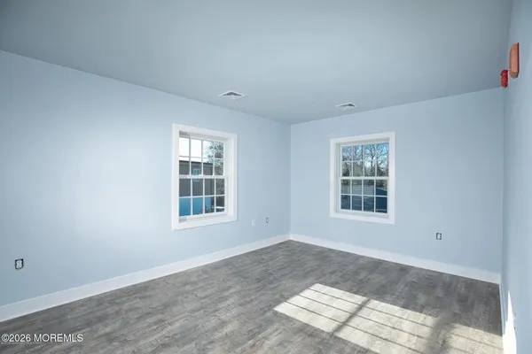 an empty room with windows