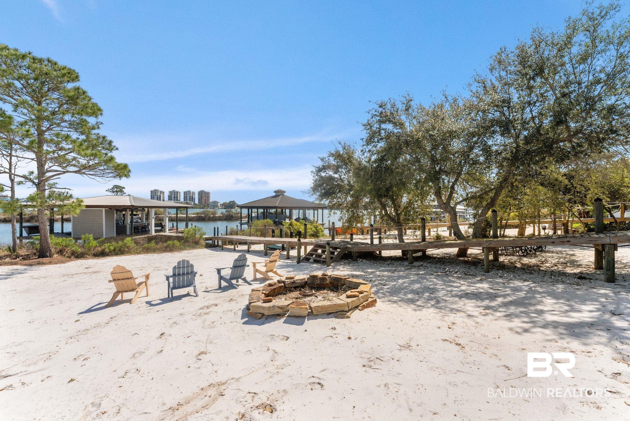 30818 River Road Orange Beach, AL 36561 - Photo 8 of 81 View of yard featuring an outdoor fire pit and a patio area