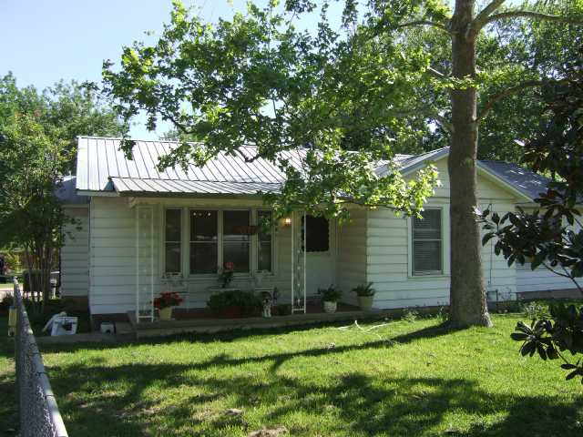 208 Chaparral Road Austin, TX 78745 - Photo 1 of 1 front view of a house with a yard