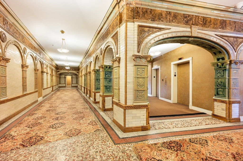 4 Charlesgate East, Unit 703 Boston, MA 02215 - Photo 10 of 15 a view of a hallway with a rug