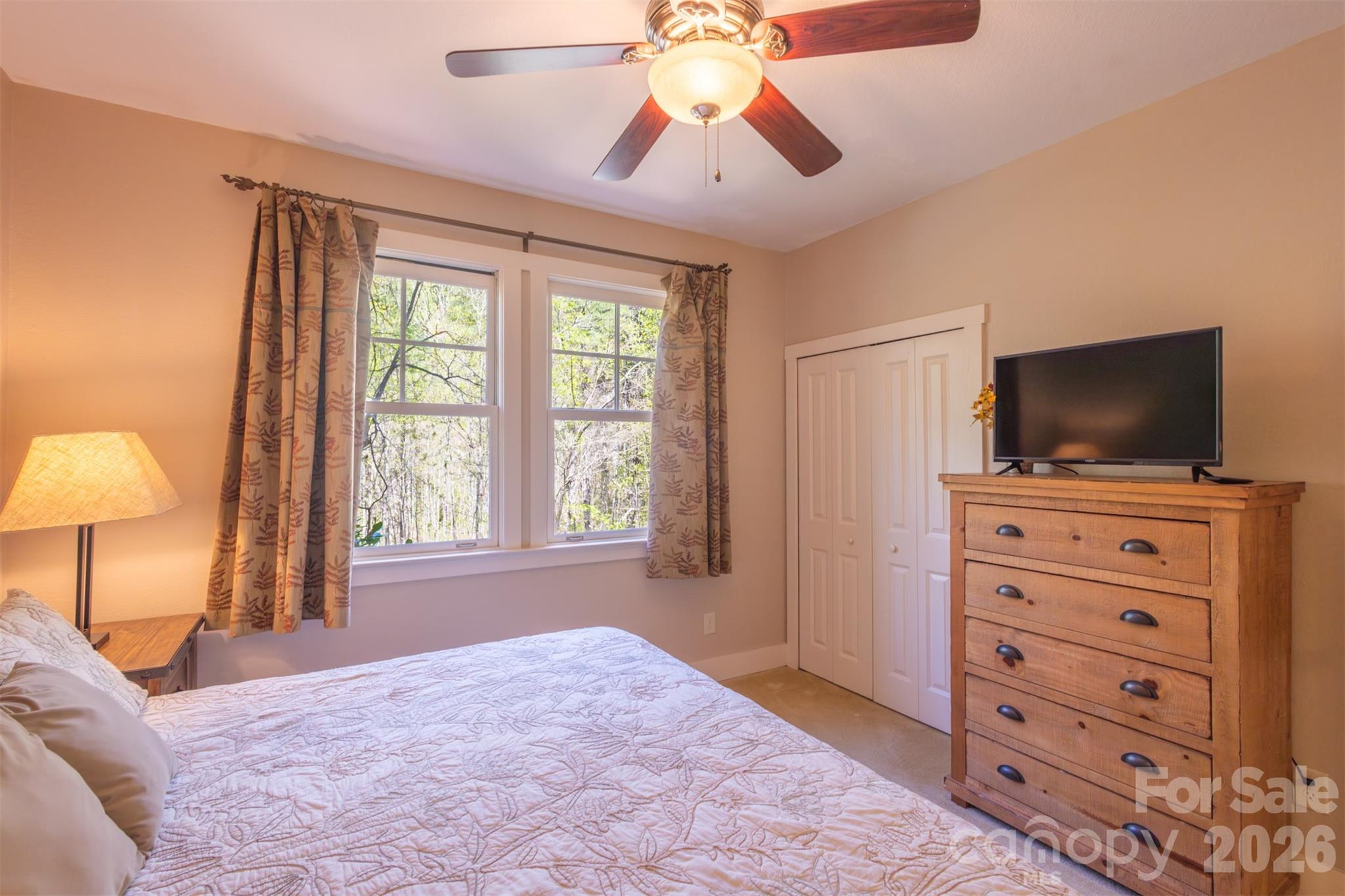 82 Mdw Rdg Court Tuckasegee, NC 28783 - Photo 20 of 39 a view of a livingroom with a flat screen tv and a window