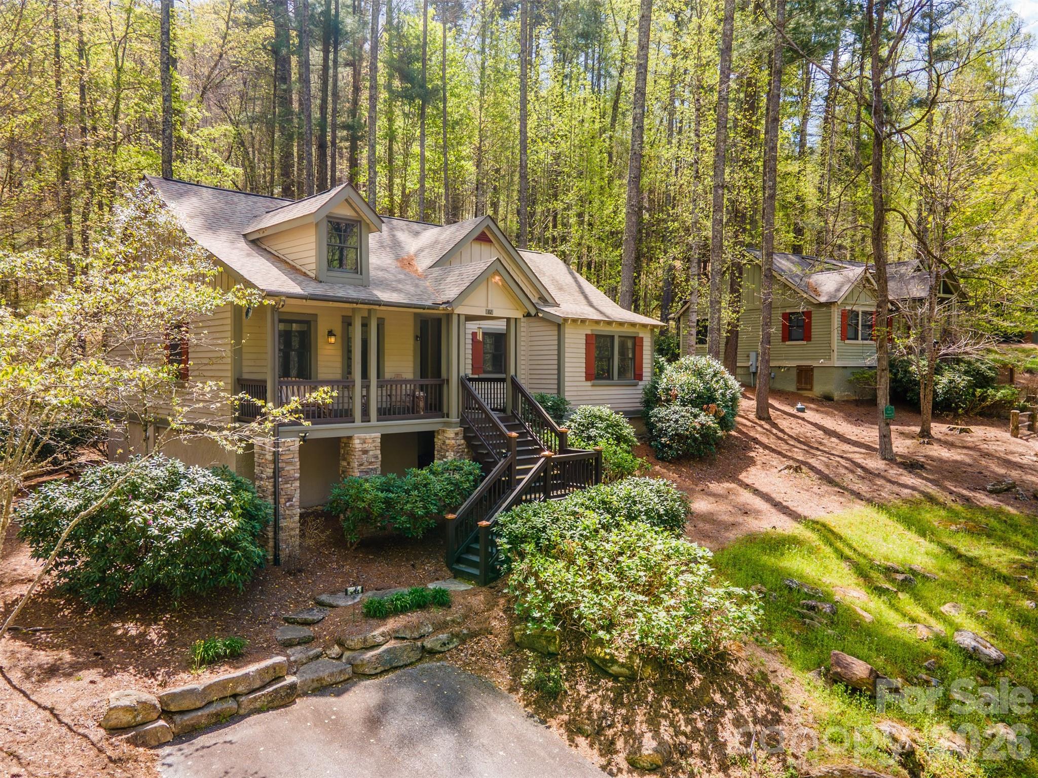 82 Mdw Rdg Court Tuckasegee, NC 28783 - Photo 3 of 39 a front view of a house with a yard
