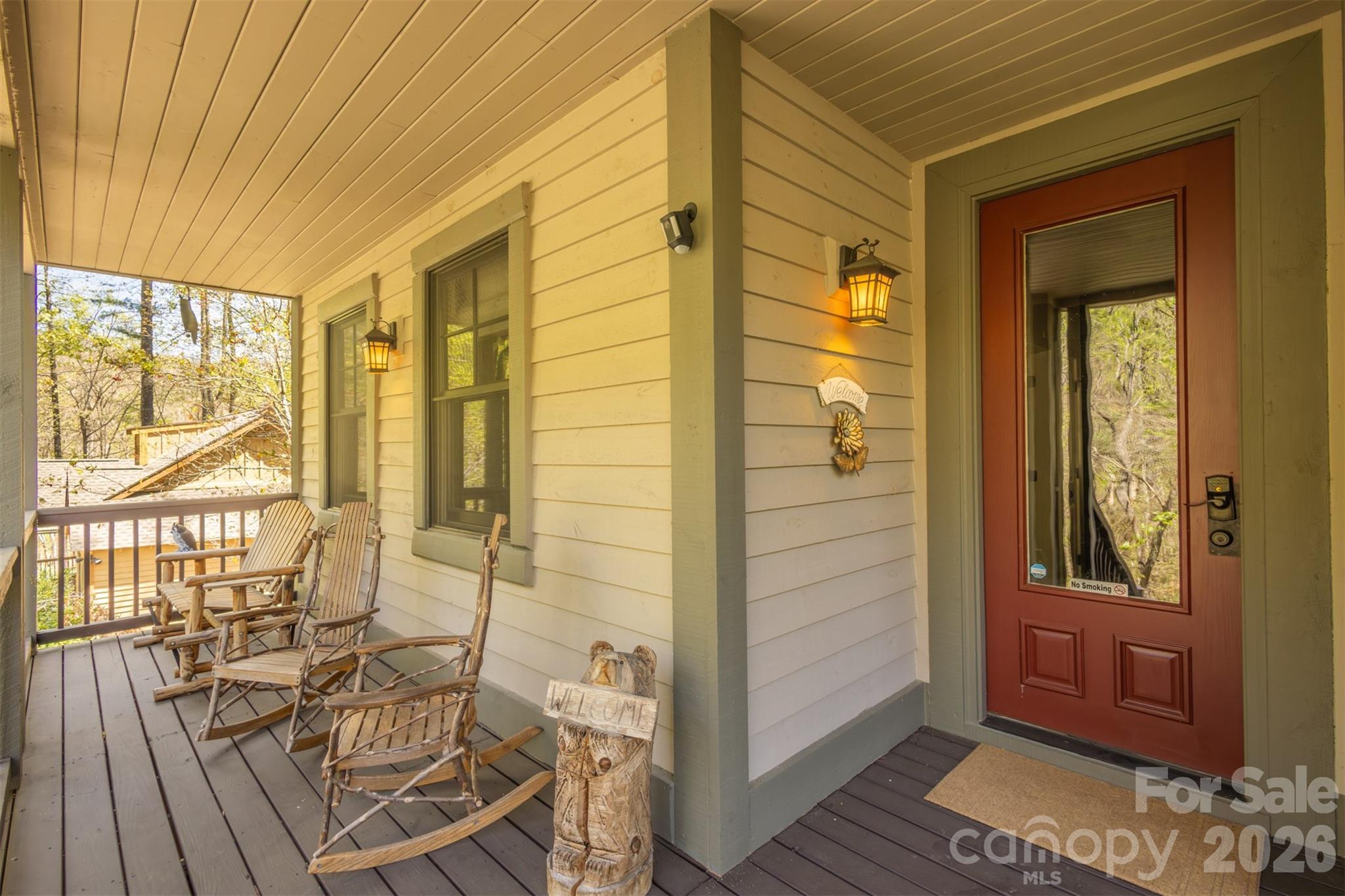 82 Mdw Rdg Court Tuckasegee, NC 28783 - Photo 4 of 39 a view of a balcony dining area with wooden floor and windows