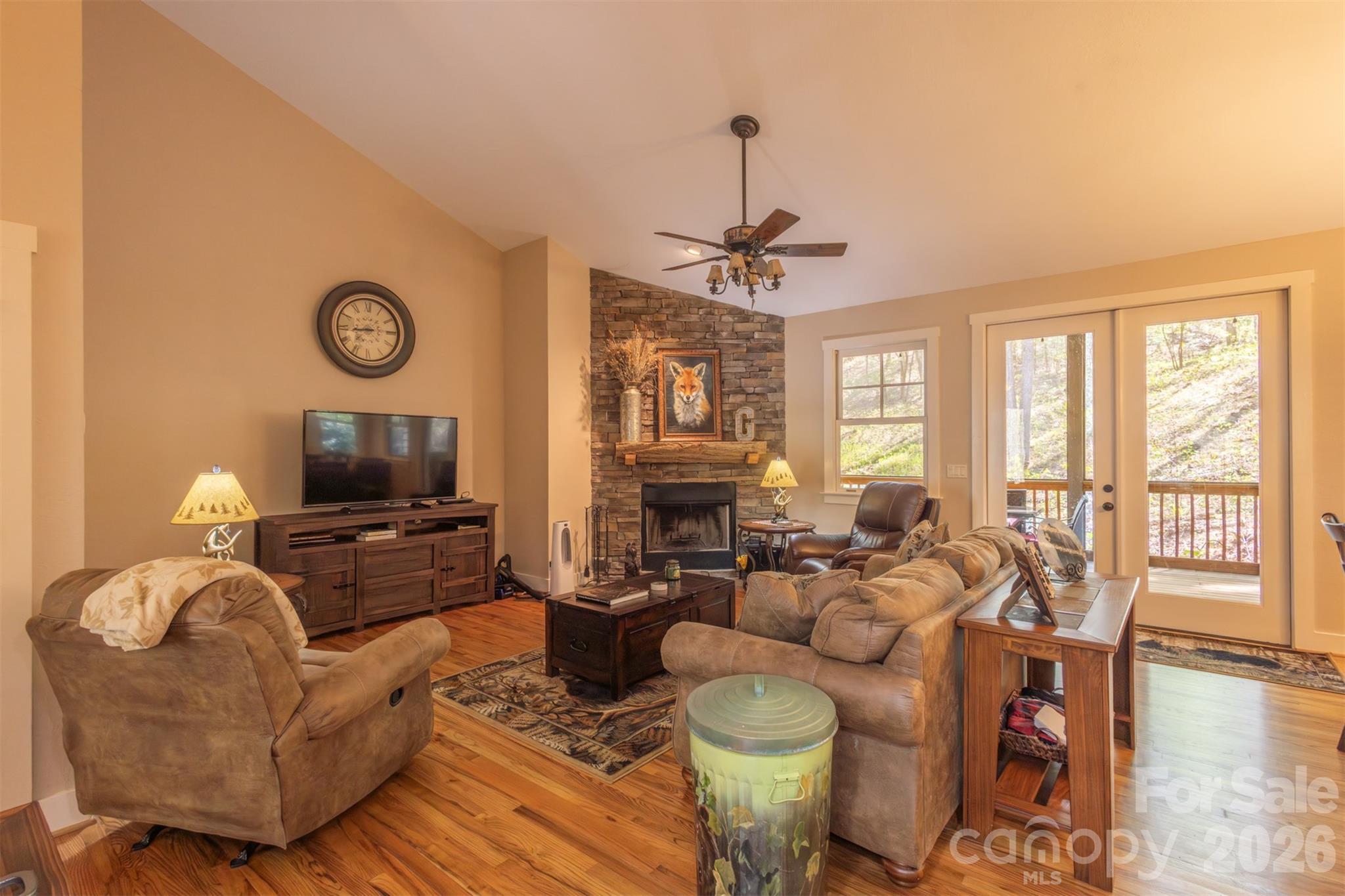 82 Mdw Rdg Court Tuckasegee, NC 28783 - Photo 6 of 39 a living room with furniture a flat screen tv and a window