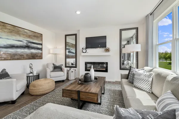 a living room with furniture fireplace and flat screen tv