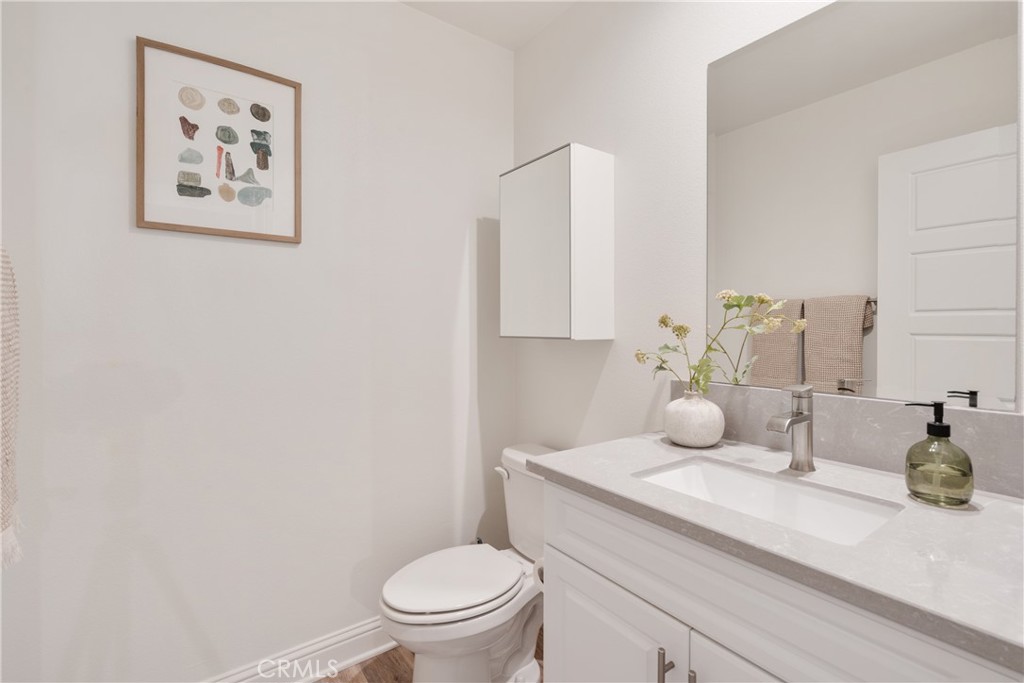 161 Steely Irvine, CA 92614 - Photo 15 of 35 a bathroom with a toilet a sink and mirror