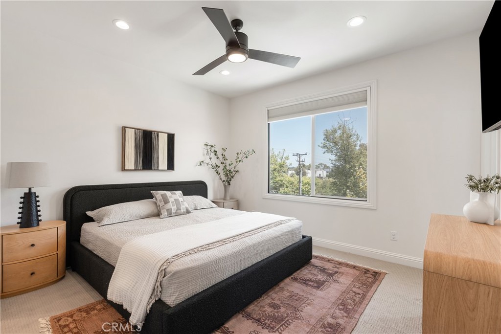 161 Steely Irvine, CA 92614 - Photo 17 of 35 a bedroom with a large bed and a window