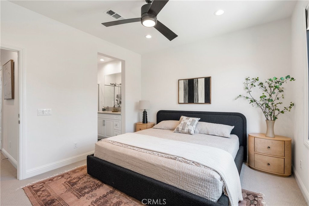 161 Steely Irvine, CA 92614 - Photo 18 of 35 a bedroom with a bed and a potted plant