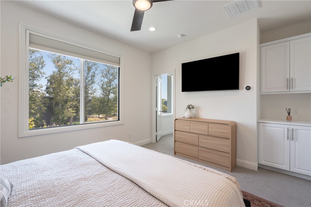 161 Steely Irvine, CA 92614 - Photo 19 of 35 a bedroom with a large bed and a flat screen tv