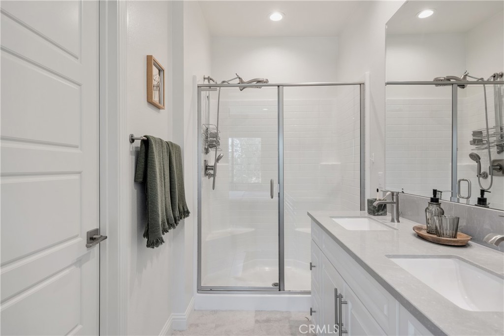161 Steely Irvine, CA 92614 - Photo 20 of 35 a bathroom with a double vanity sink a mirror and shower