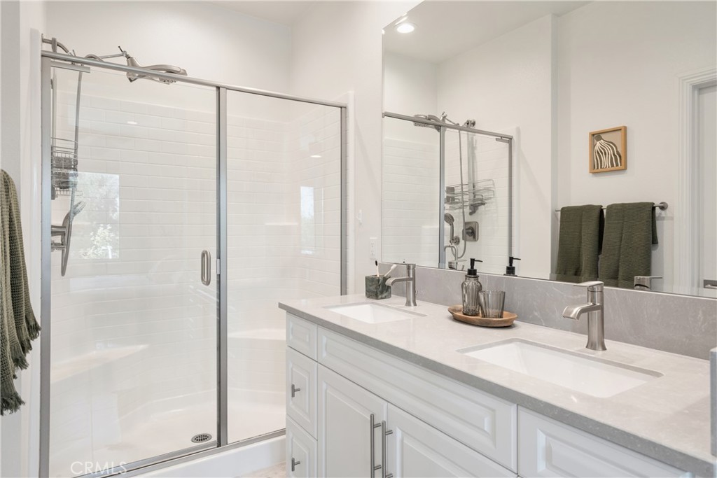 161 Steely Irvine, CA 92614 - Photo 21 of 35 a bathroom with double vanity sink and a mirror